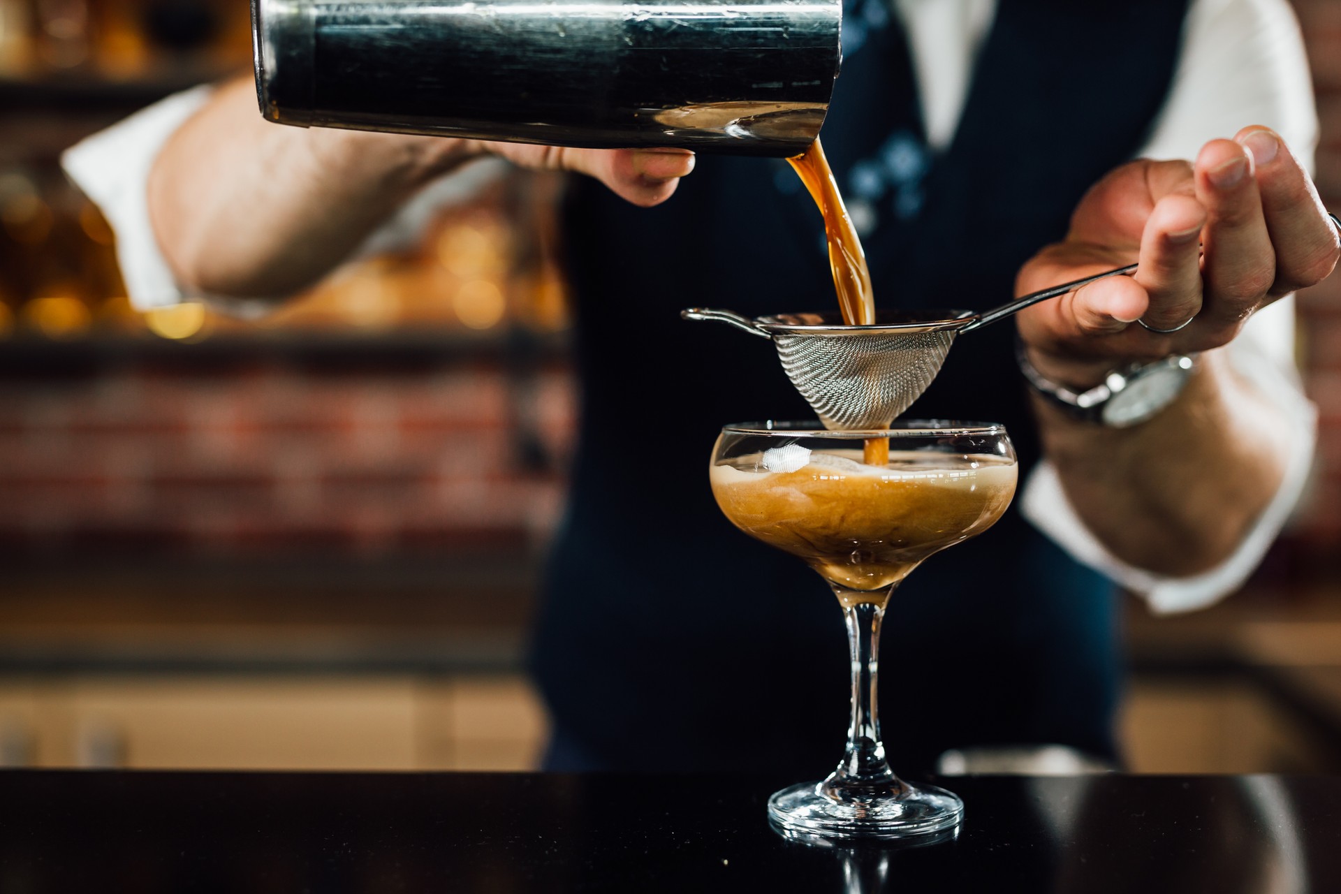 barman prepares cocktail